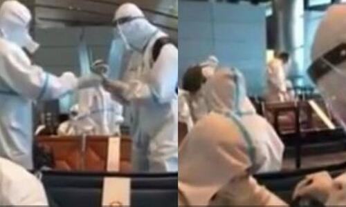 Κορονό – απίστευτο: Παίκτες κινεζικής ομάδας ταξιδεύουν με στολές σκάφανδρα! thumb